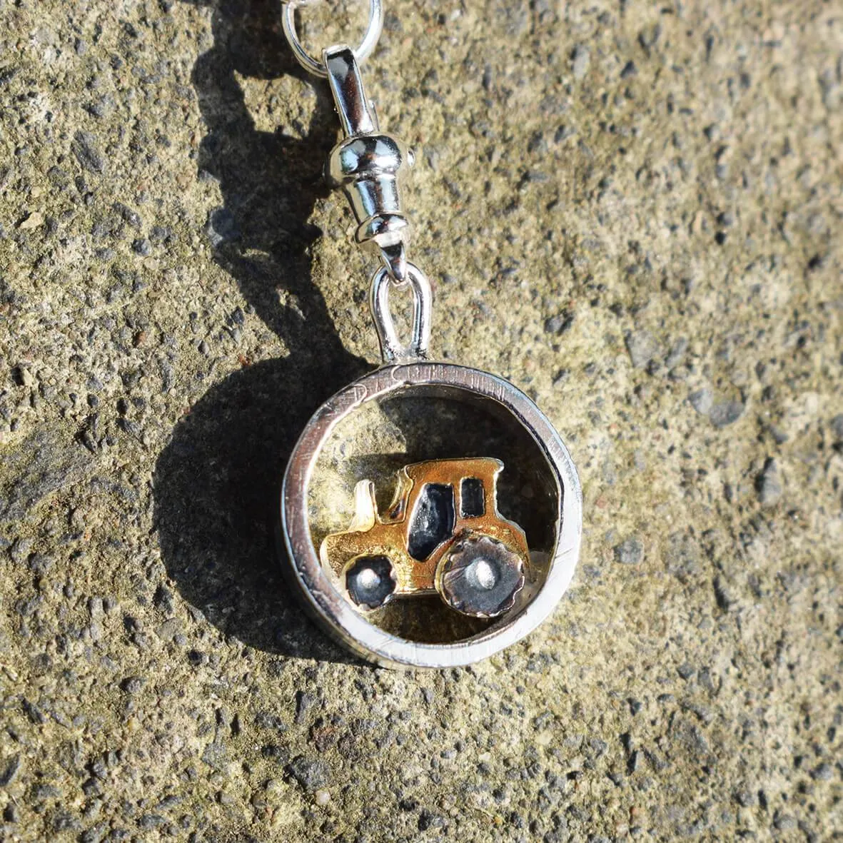 Gold tractor charm