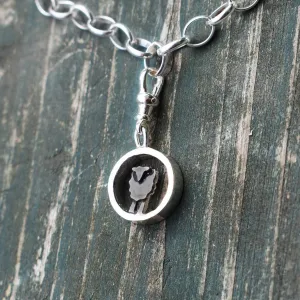 Silver circle black sheep charm