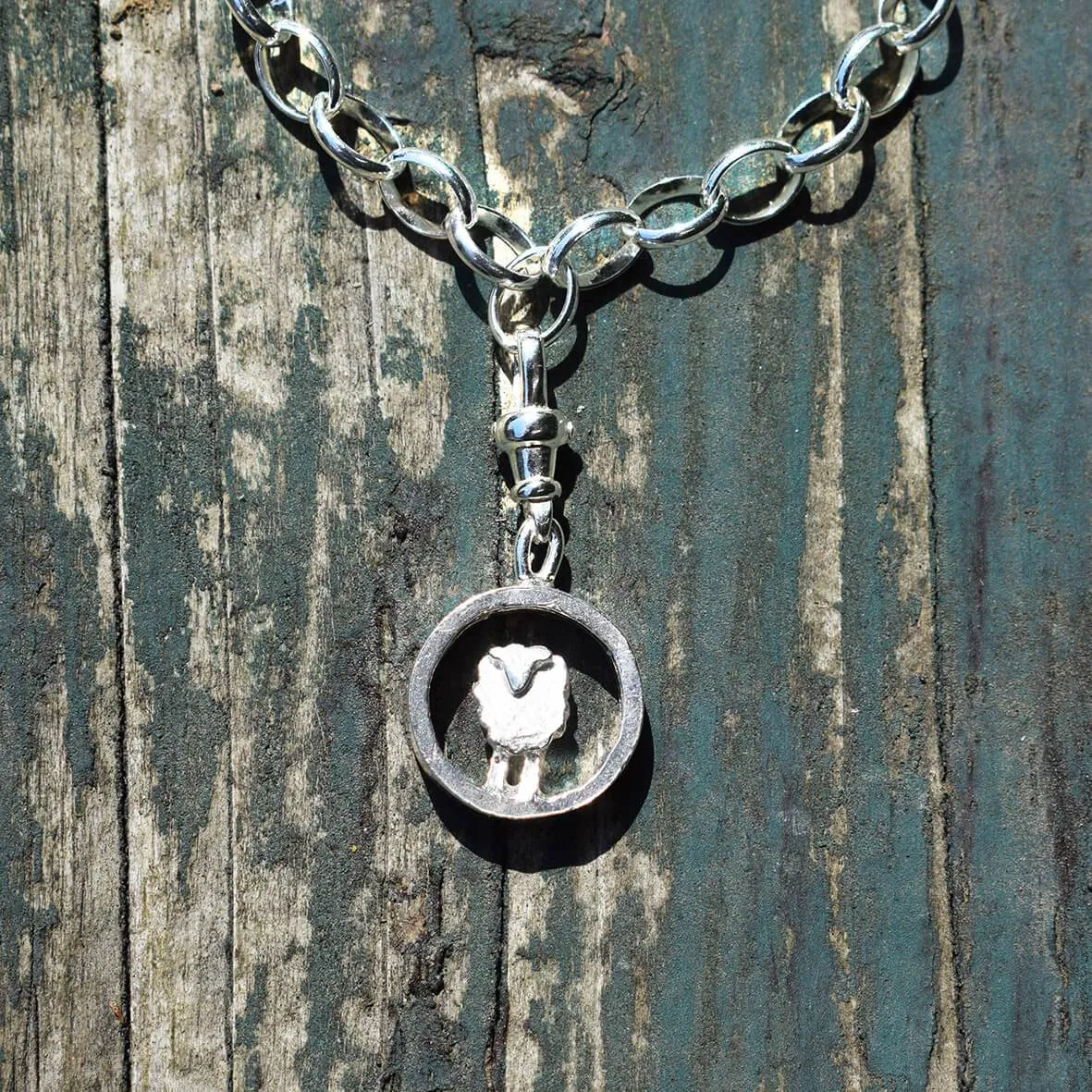 Silver circle sheep charm